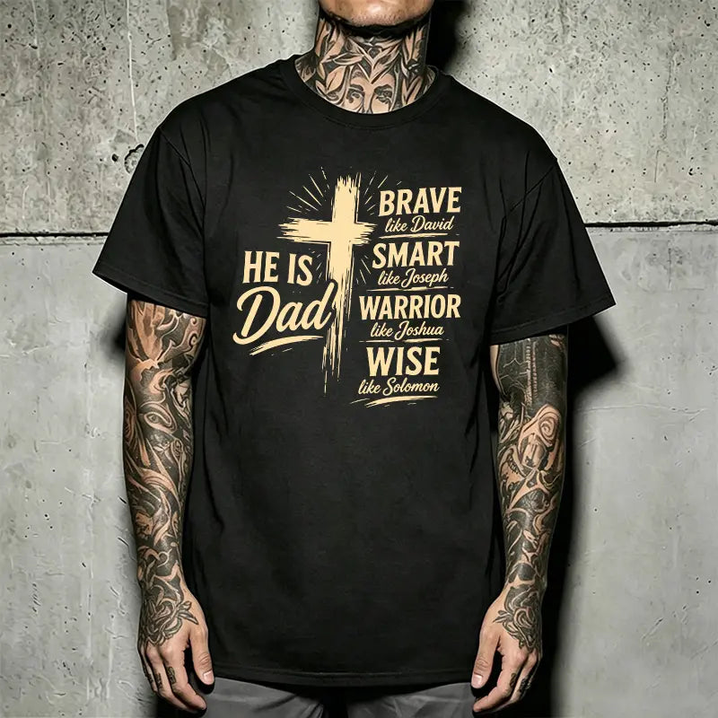 Men’s Christian “Dad” graphic T-shirt: “He Is Dad — Brave, Smart Warrior, Wise”; religious Father’s Day short-sleeve tee with cross print; casual inspirational top for everyday wear, church, and family events