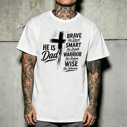 Men’s Christian “Dad” graphic T-shirt: “He Is Dad — Brave, Smart Warrior, Wise”; religious Father’s Day short-sleeve tee with cross print; casual inspirational top for everyday wear, church, and family events