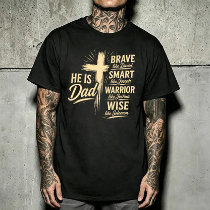 Men’s Christian “Dad” graphic T-shirt: “He Is Dad — Brave, Smart Warrior, Wise”; religious Father’s Day short-sleeve tee with cross print; casual inspirational top for everyday wear, church, and family events