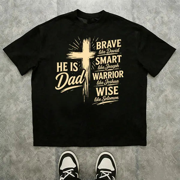 Men’s Christian “Dad” graphic T-shirt: “He Is Dad — Brave, Smart Warrior, Wise”; religious Father’s Day short-sleeve tee with cross print; casual inspirational top for everyday wear, church, and family events